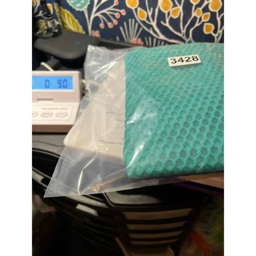 A New Day Green Zip Around Continental Wallet Wristlet‎ and a blue/teal pouch